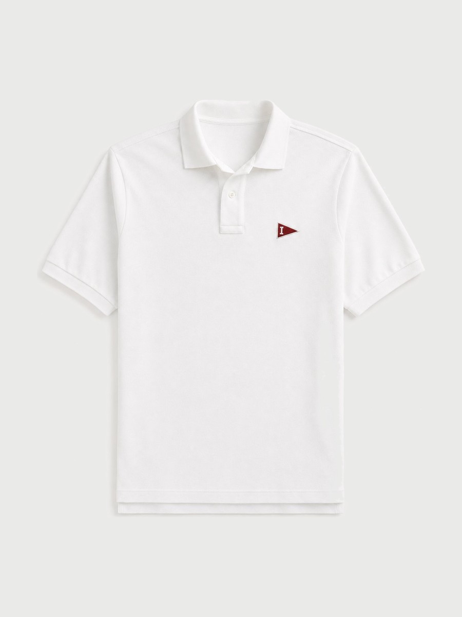 White pique polo with a crimson Indiana pennant patch at the chest.