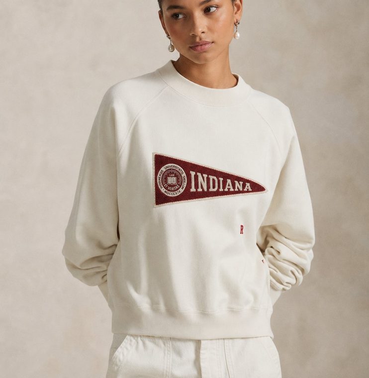 Women's cream crewneck sweatshirt with an Indiana pennant patch.
